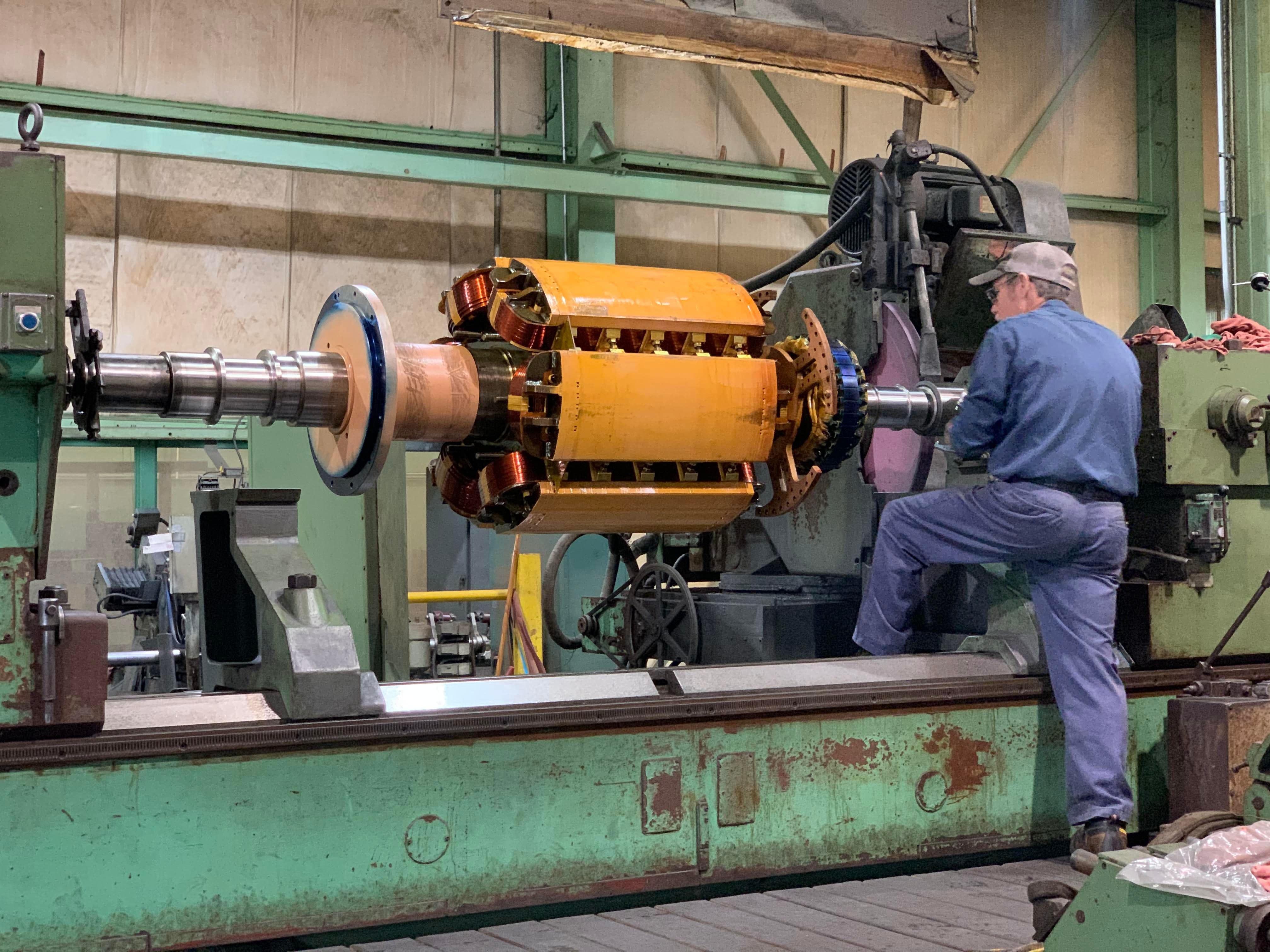 Grinding chrome plated bearing journals on large motor rotor